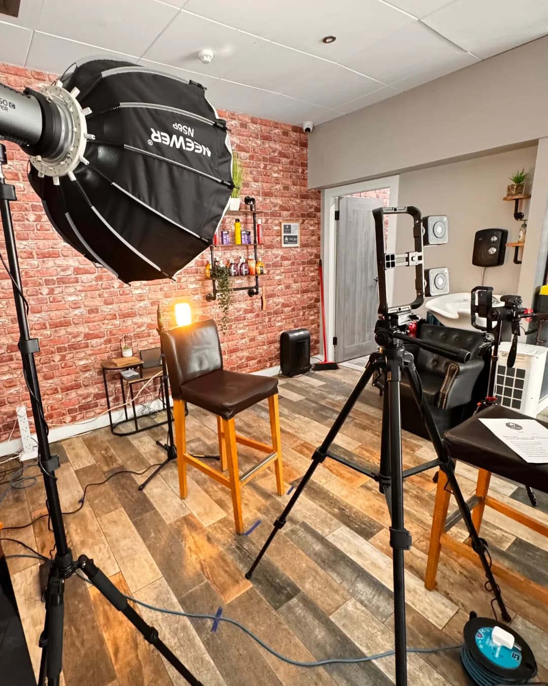 Professional interview filming setup with lighting and cameras